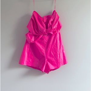 Pink romper size L never worn new with tags